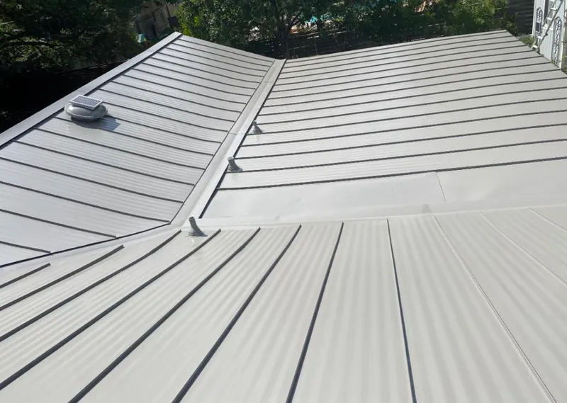 Solar attic fan installed on a metal roof for Roof Ventilation in San Martin